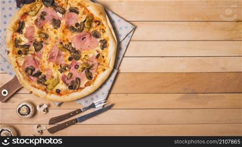overhead view homemade pizza with mushroom wooden table