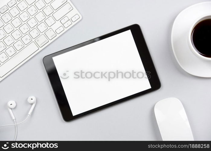 overhead view keyboard earphone mouse digital tablet coffee cup gray background . Resolution and high quality beautiful photo. overhead view keyboard earphone mouse digital tablet coffee cup gray background . High quality and resolution beautiful photo concept