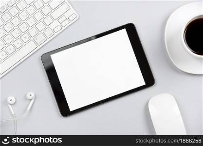 overhead view keyboard earphone mouse digital tablet coffee cup gray background . Resolution and high quality beautiful photo. overhead view keyboard earphone mouse digital tablet coffee cup gray background . High quality and resolution beautiful photo concept