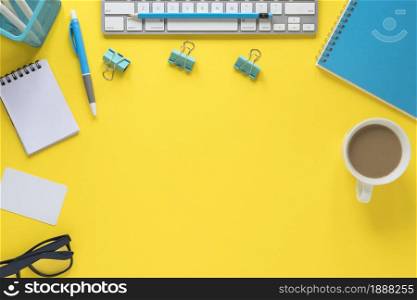overhead view keyboard eyeglasses tea cup yellow workspace . Resolution and high quality beautiful photo. overhead view keyboard eyeglasses tea cup yellow workspace . High quality and resolution beautiful photo concept