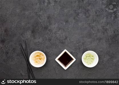 overhead view marinated ginger wasabi soya sauce with chopstick blackboard. Resolution and high quality beautiful photo. overhead view marinated ginger wasabi soya sauce with chopstick blackboard. High quality beautiful photo concept