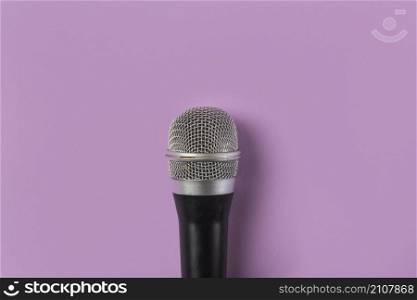 overhead view microphone pink background