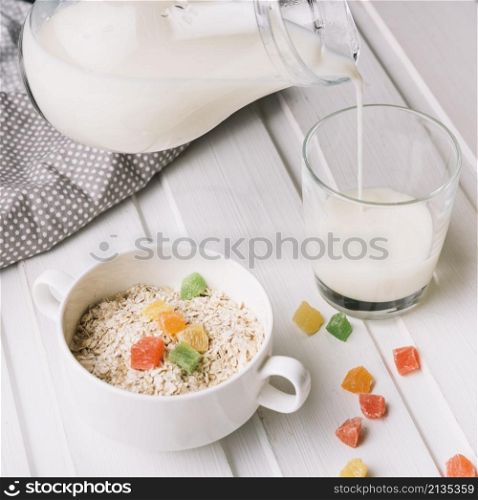 overhead view oatmeal with glass milk white table