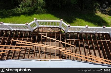 Overhead view of aged outdoor wooden cedar deck being tore down