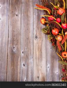 Overhead view of autumn decorations on rustic wooden boards.