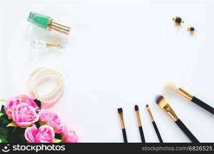 Overhead view of brush and female accessories isolated on white background with copy space