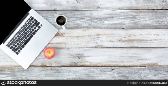 Overhead view of desktop with coffee and apple plus plenty of copy space