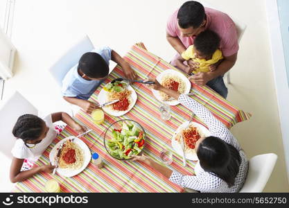 Overhead View Of Family Eating Meal Together