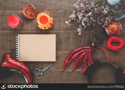 Overhead view of Halloween party accessories on wooden background, Top view halloween concept with color filter