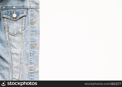 Overhead view of jeans jacket on white background with copy space,
