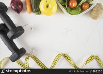 overhead view of measuring tape food and dumbbell on white backdrop . Resolution and high quality beautiful photo. overhead view of measuring tape food and dumbbell on white backdrop . High quality and resolution beautiful photo concept