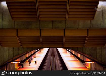 Overhead view of underground Montreal Metro train station.