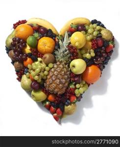 Overhead view of various types of fruit in heart shape on white background