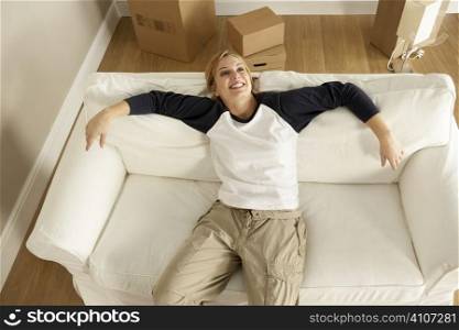 Overhead View Of Young Woman Moving Into New Home