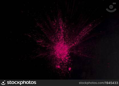 overhead view pink color exploding black surface. High resolution photo. overhead view pink color exploding black surface. High quality photo
