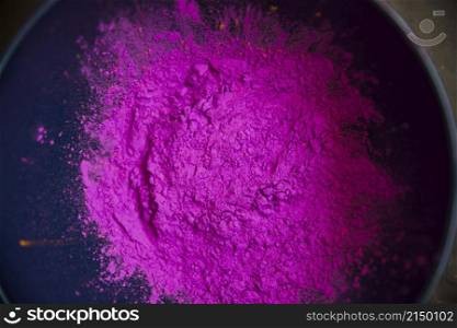 overhead view pink color powder inside bowl