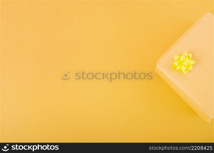 overhead view present gift box yellow background