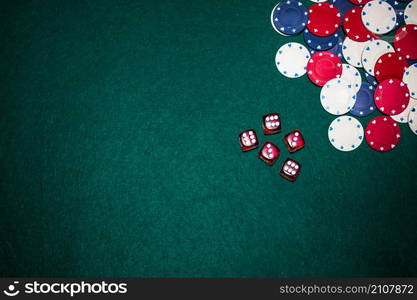 overhead view red dices casino chips green poker background