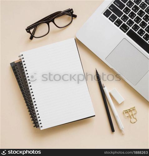 overhead view stationeries laptop beige background . Resolution and high quality beautiful photo. overhead view stationeries laptop beige background . High quality and resolution beautiful photo concept