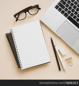 overhead view stationeries laptop beige background . Resolution and high quality beautiful photo. overhead view stationeries laptop beige background . High quality and resolution beautiful photo concept