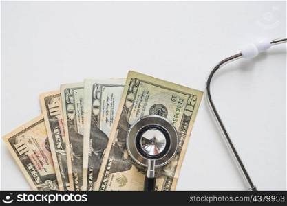 overhead view stethoscope us currency note white background