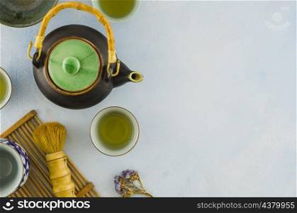 overhead view traditional chinese teaware with brush white background