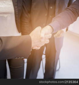 overhead view two businessman shaking hands together