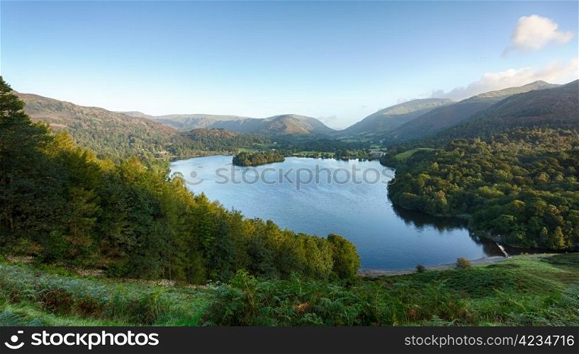 Overlook of Grasmere in Lake District as sunrise as sun light mountains