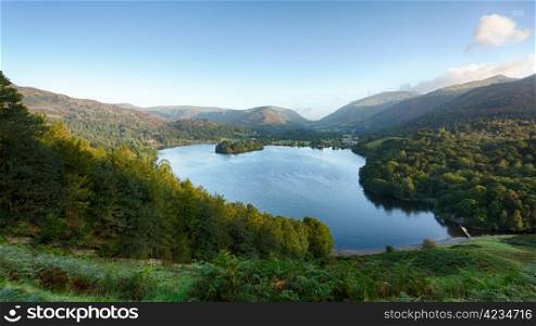 Overlook of Grasmere in Lake District as sunrise as sun light mountains