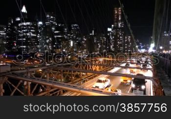 Overlooking the traffic on Brooklyn Bridge at night, Manhattan in the background