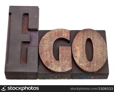 oversized ego concept - word in vintage wood letterpress printing blocks, stained by color inks, isolated on white