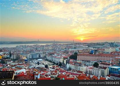 Overview of Lisbon city center and Tagus river at sunset, Portugal