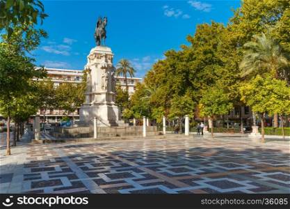 Overview of the New Square, Plaza Nueva, with the monument to King Ferdinand III in the center, in the sunny summer day, Seville, Andalusia, Spain