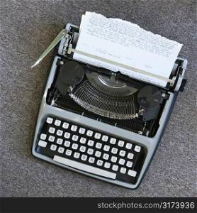 Overview of typewriter with paper that has been typed on.
