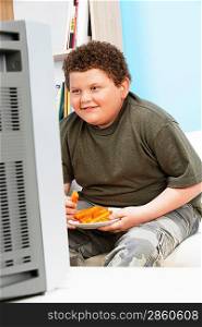Overweight Child Eating Carrot Sticks