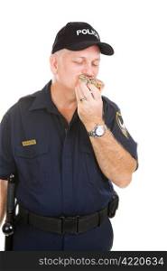 Overweight policeman chowing down on a donut. Isolated on white.