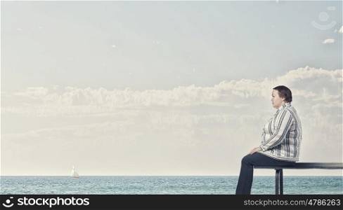 Overweight problem. Middle aged stout woman sitting on bench