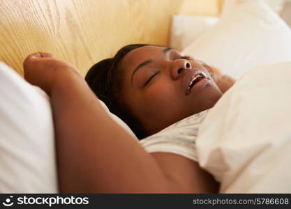 Overweight Woman Asleep In Bed Snoring