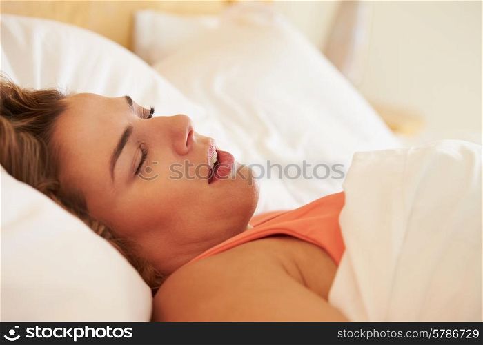 Overweight Woman Asleep In Bed Snoring