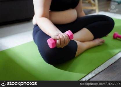 Overweight woman exercising for weight loss. exercise with dumbbells in stretching positions at home in the living room Cheerful Fat woman diet healthy lifestyle concept