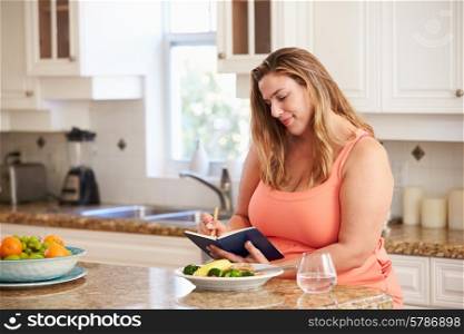 Overweight Woman On Diet Keeping Food Journal
