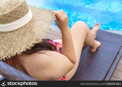 Overweight young woman orange swimsuit and straw beach sun hat relaxing in pool Happy plus size woman body positive Vacation Traveling in summer