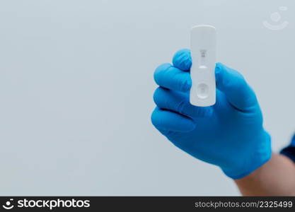 Own hand showing Covid-19 negative test result with SARS CoV-2 Rapid antigen test kit