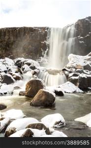 Oxararfoss Waterfall in the winter in pingvellir valley National Park in Iceland