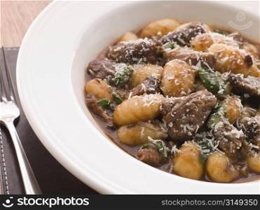 Oxtail Braised in Red Wine with Basil Gnocchi and Parmesan Cheese