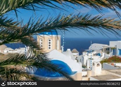 Oya. Traditional local architecture.. White houses and church with blue dome at dawn in the village Oia. Santorini. Greece.