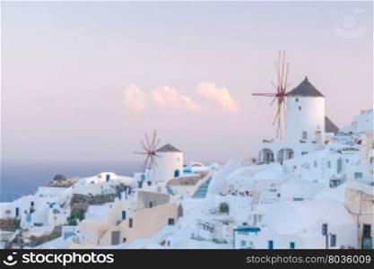 Oya. White windmills.. White windmills at sunset in the village Oia. Santorini. Greece.