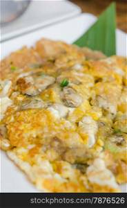 Oyster Omelette. Southeast Asian Fried Baby Oyster Omelette on dish