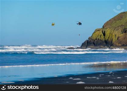 Pacific coast, Cape Disappointment, WA, USA. Coast guard helicopters in the sky.