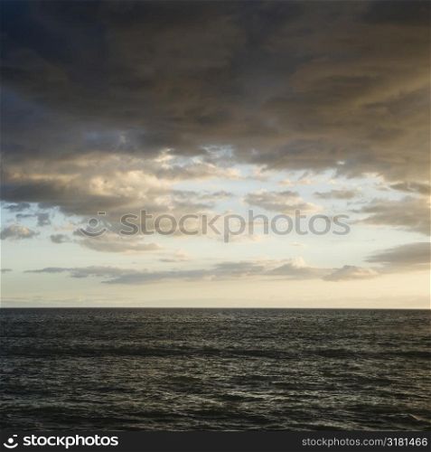 Pacific ocean and cloudy sky in Maui, Hawaii.